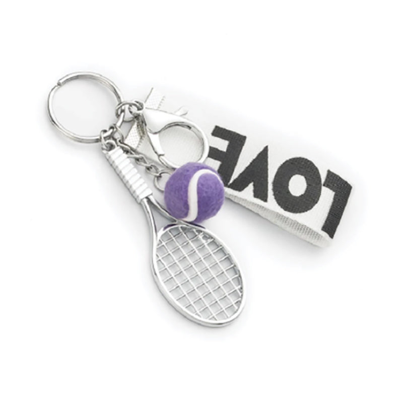 Pink tennis racquet keychain from RACQUET INC featuring a miniature tennis racquet charm, perfect for tennis enthusiasts.